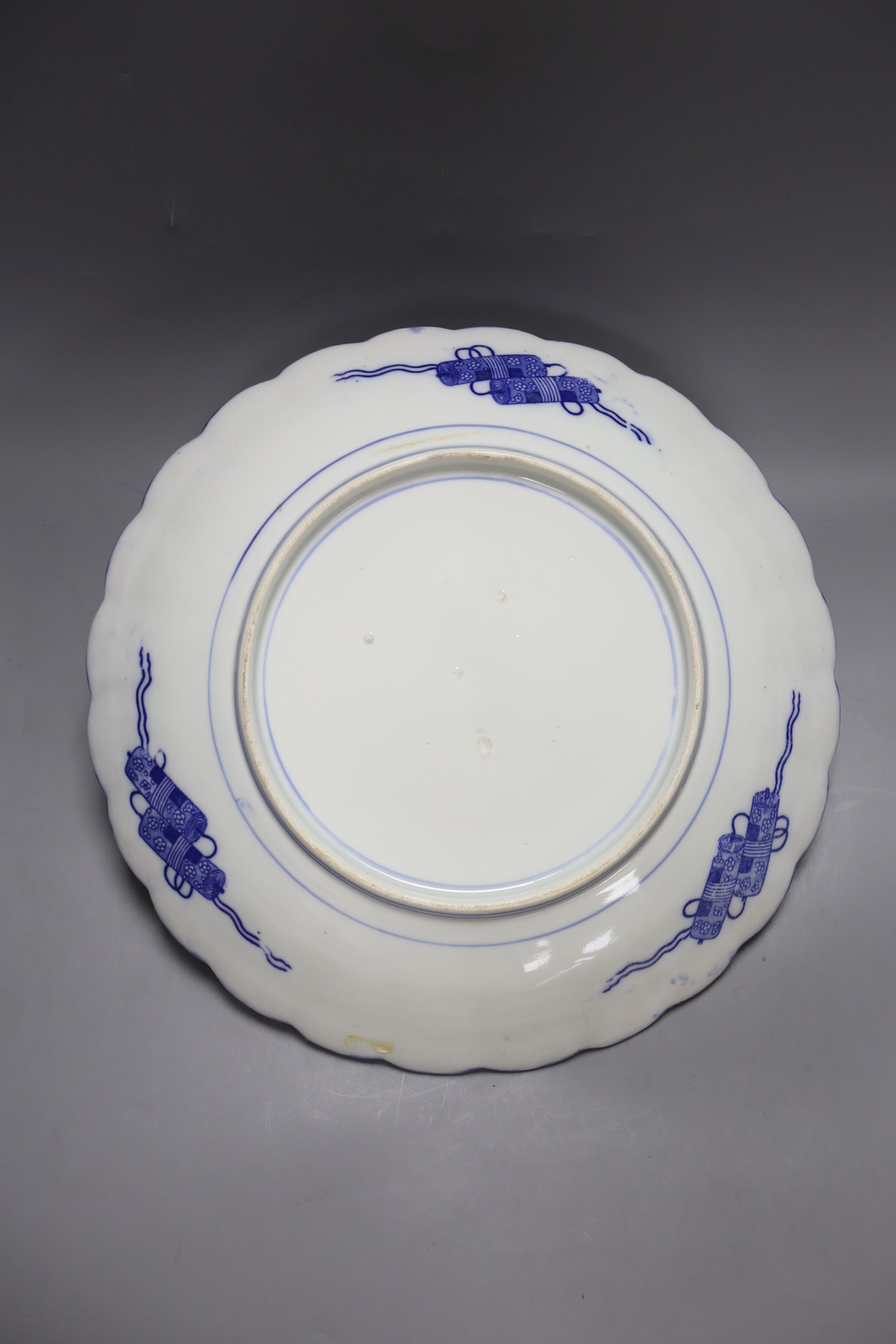 Two Chinese Imari dishes, three Chinese blue and white dishes, a larger Japanese blue and white dish, 5 Japanese blue and white saucer dishes and 2 miniature blue and white jardinieres. 40cm